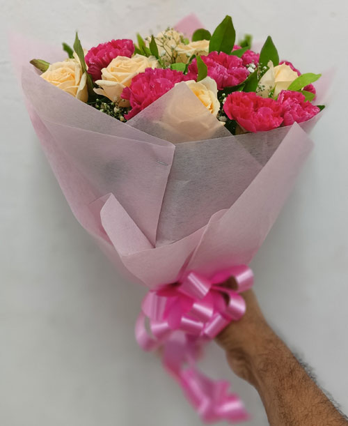 Blooming Elegance: 10 Pink Carnation and 10 Peach Roses Bunch in Paper Wrap