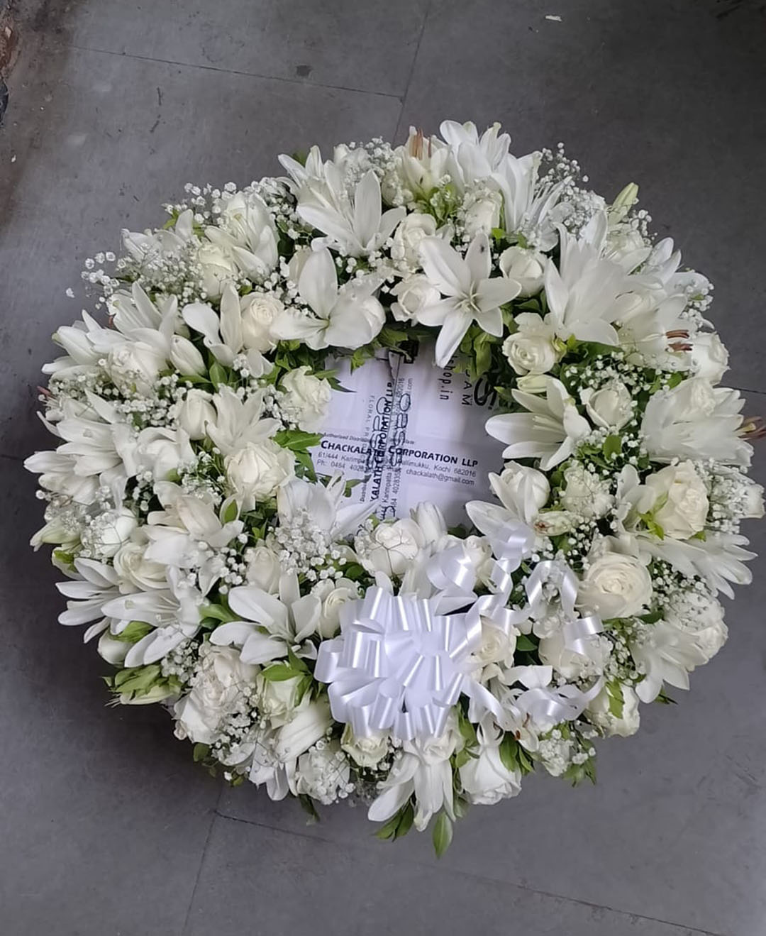 White Lilies And Roses Round Wreath Arrangement