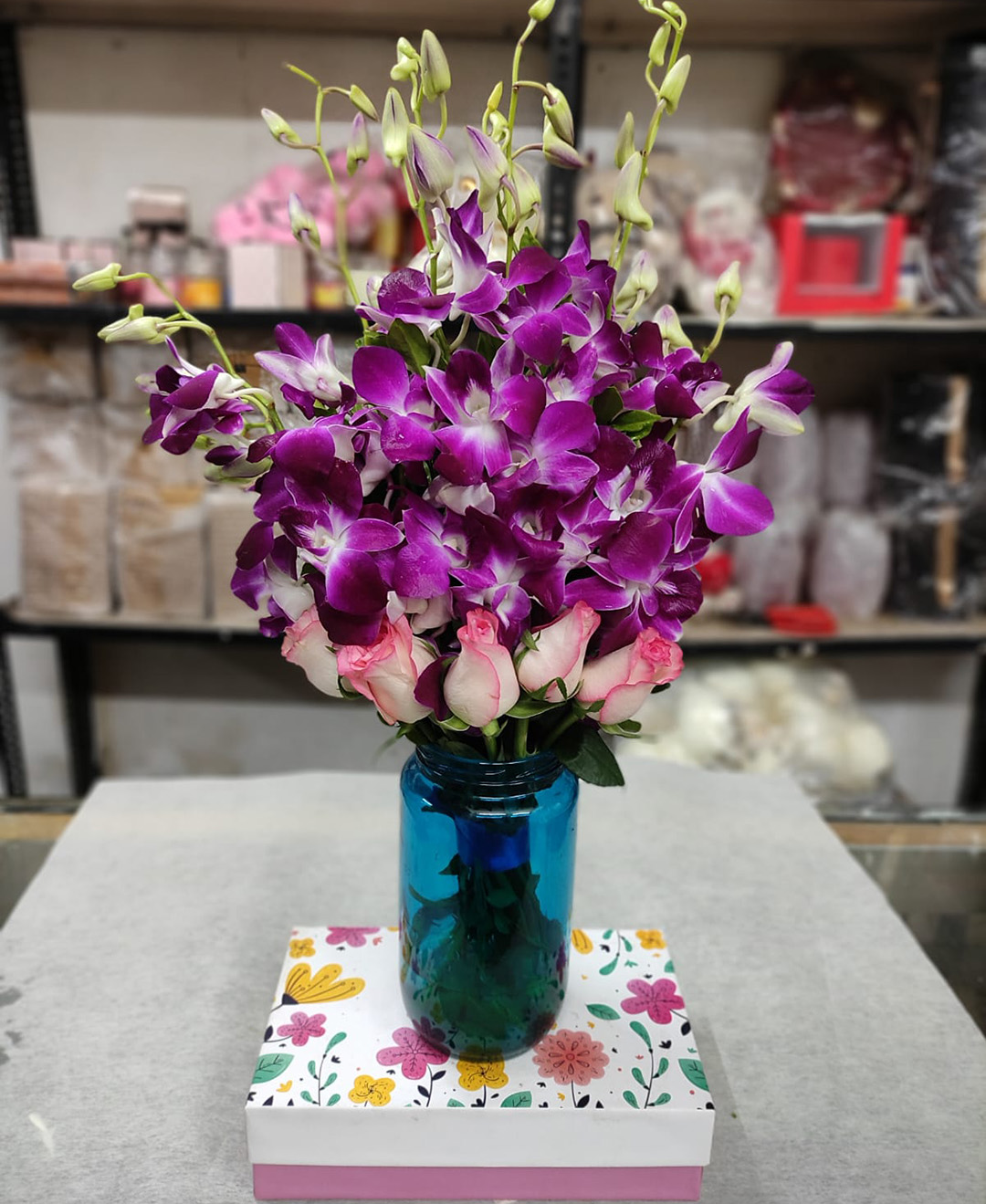 6 Orchids And 5 Pink Roses Blue Vase