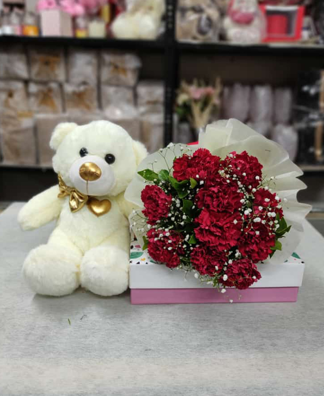12inch Teddy And 10 Red Carnation Bunch With Paper Packing