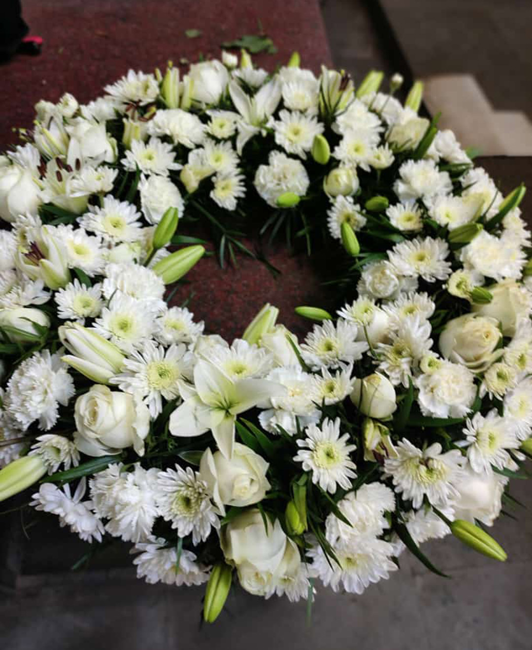 White Lillies White Roses Chysamthimum Round Wreath Arrangement